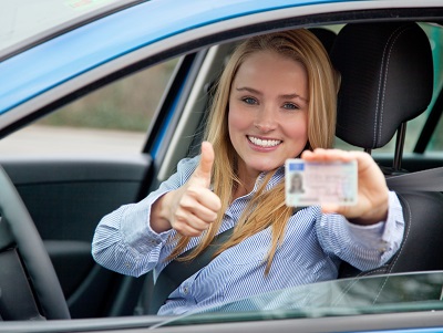 image of woman giving thumbs up to point free license
