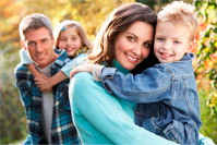 family posing outside