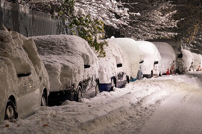 image of cars under a blanket of snow