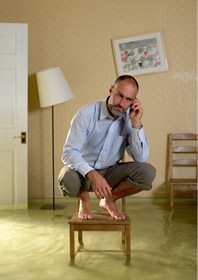 man in flooding house